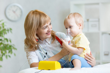 Doctor holding inhaler mask for kid breathing
