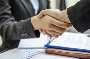 Business persons shaking hand as a deal