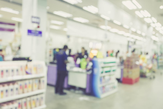 Supermarket store blur background ,Cashier counter with customer