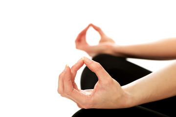 Woman hands in ohm yoga pose