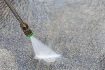Outdoor floor cleaning with high pressure water jet