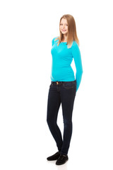 Young woman standing with toothy smile