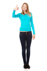 Fototapeta premium Happy female student showing thumbs up