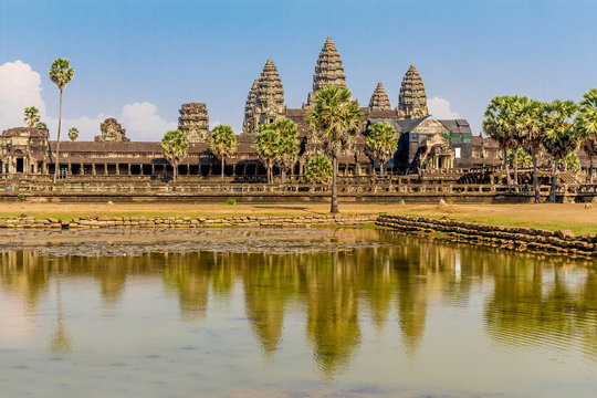 Angkor Wat seen across the lake, reflected in water