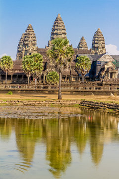Angkor Wat seen across the lake, reflected in water