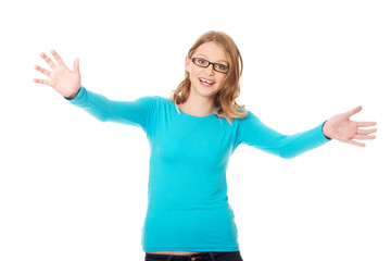 Fototapeta premium Happy teenage woman with arms wide open