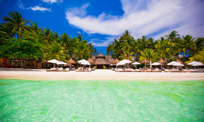 Tropical white sunny beach in beautiful exotic luxury resort