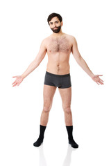 Fototapeta premium Young shirtless man with arms wide open.