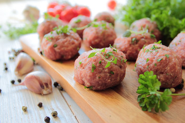 Raw meat balls with parsley and thyme herbs