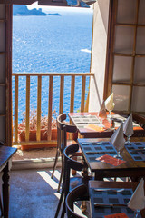 Served table set at outdoor cafe with perfect view