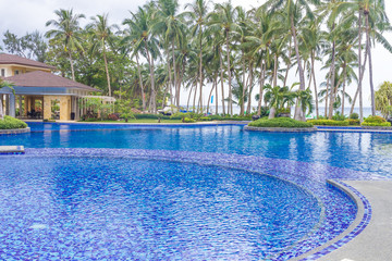 beautiful water pool in tropical hotel, summer vacation image