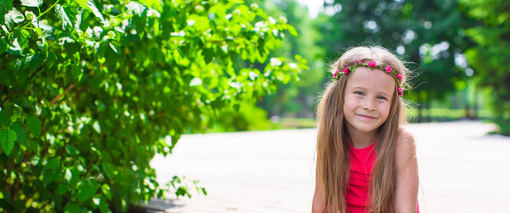 Portrait of adorable little girl on a warm summer day