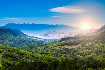 Beautiful sunset over the sea and mountain range