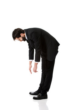 Young Businessman Bending Down.