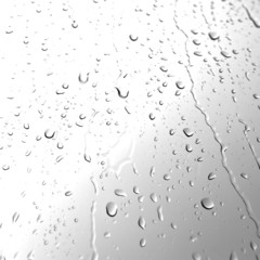 Water drops on glass in monochrome