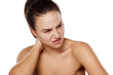 Naklejka premium young woman has pain in the neck