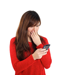 Naklejka premium Asian girl in disbelief with mobile phone