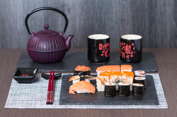 Sushi served on a black ceramic