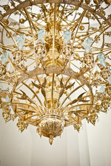 Vault in church with brass chandelier