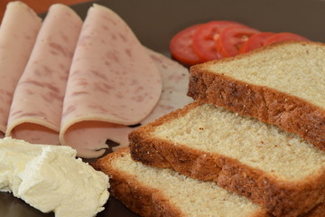 Close up toast with cheese, tomatoes and smoked ham 
