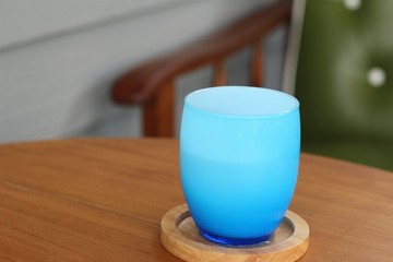 Blue glass of water on table