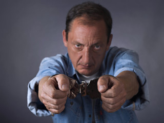 Man, mature, with handcuffs
