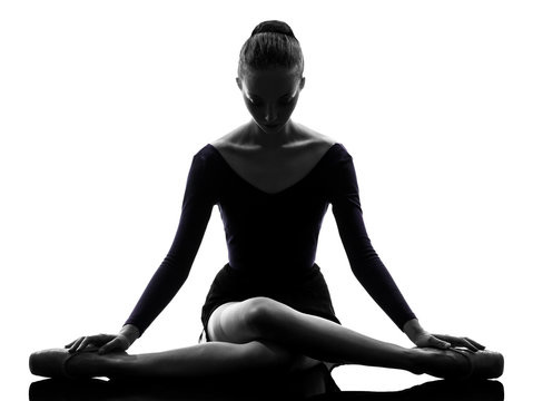 Fototapeta young woman ballerina ballet dancer stretching warming up  silho