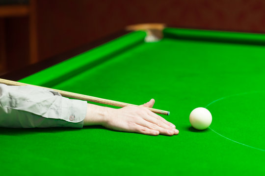 Snooker Player Aiming For White Ball