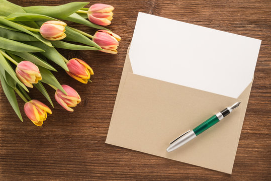Flowers, envelope and pen