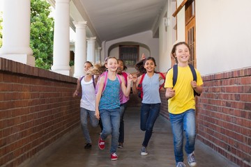 Cute pupils running down the hall