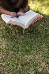 Woman reading book in the park