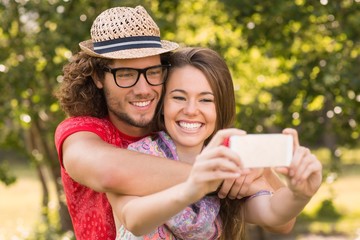 Friends taking a selfie in the park