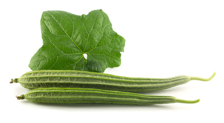 Fresh angled gourd - vegetable with leaf on white