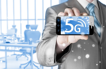 businessman holding in hand 5G, technology background
