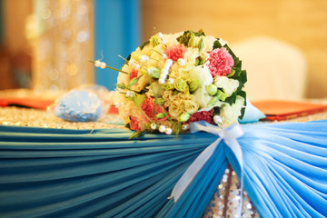 a packet of coloful petals in hasket