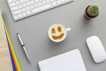 Cup of cappuccino with smiley shape on the froth