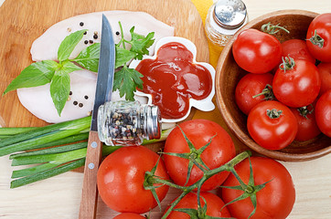 Raw chicken breasts on cutting board