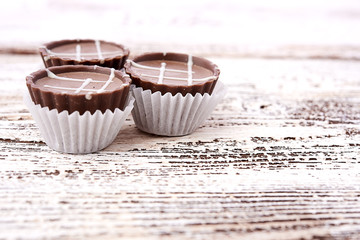 Dark chocolate on wooden background