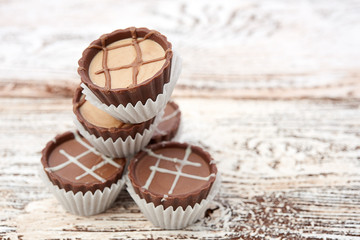 Dark chocolate on wooden background