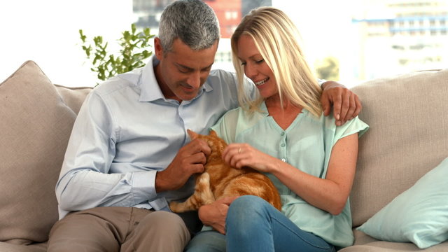 Happy couple with their cat