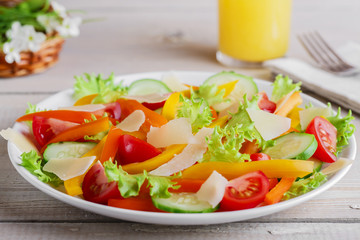 vegetable salad with tomato cucumber pepper and parmesan cheese