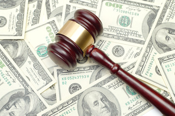 gavel on dollar background