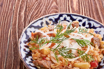 Oriental shah pilaf, pilaw, plov, rice with meat in pastry filo