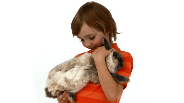 Cute boy with pet rabbit
