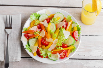 vegetable salad with tomato cucumber pepper and parmesan cheese