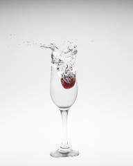 Close-up image of strawberry dropped to water