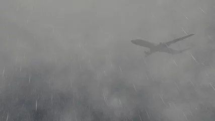 Zelfklevend Fotobehang Onweer Airliner flies through a storm 1