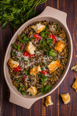 Stewed lentils with bacon, peppers and croutons