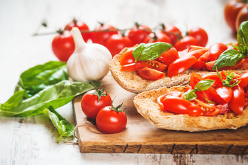 Italian starter, bruschetta with Sicilian red fresh tomato on a