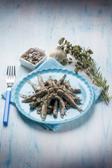 raw anchovies with capers herbs and olive oil